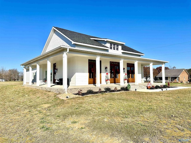 view of front of home featuring a front yard and a porch