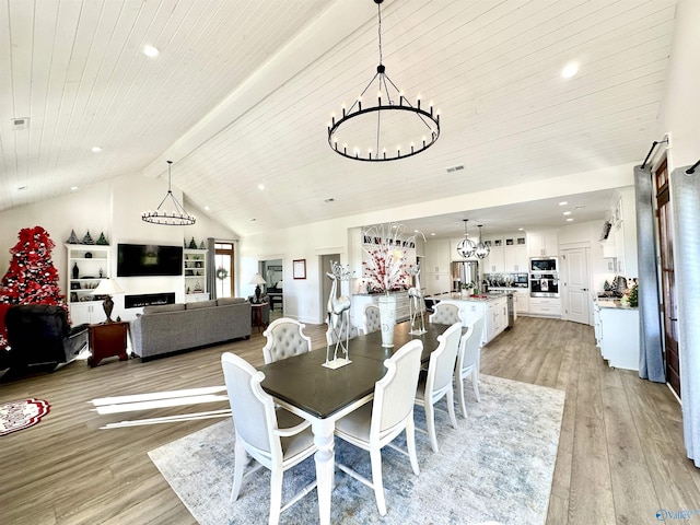 dining area with wooden ceiling, an inviting chandelier, light hardwood / wood-style flooring, high vaulted ceiling, and beam ceiling