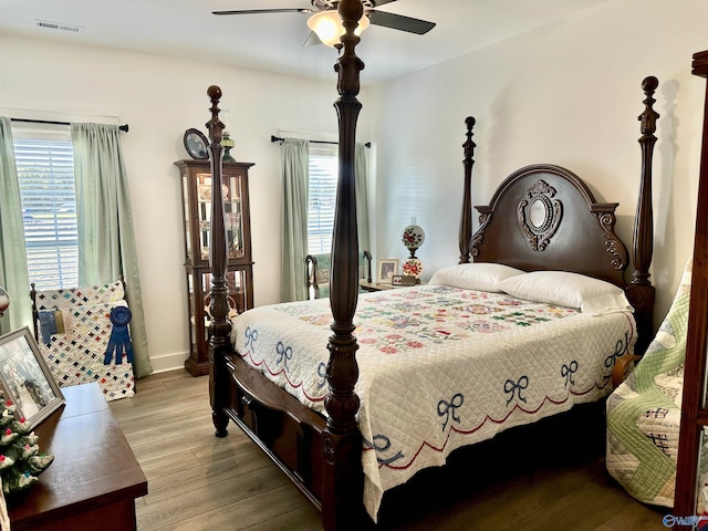 bedroom featuring ceiling fan and light hardwood / wood-style flooring