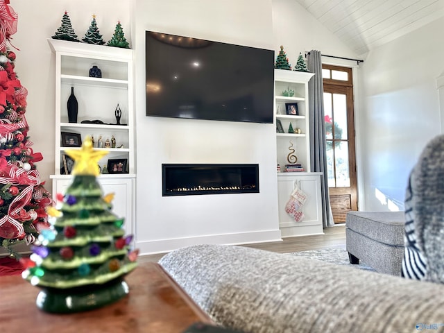 living room with lofted ceiling and hardwood / wood-style floors