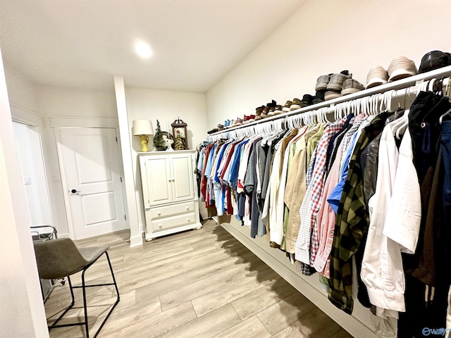 walk in closet featuring light hardwood / wood-style floors