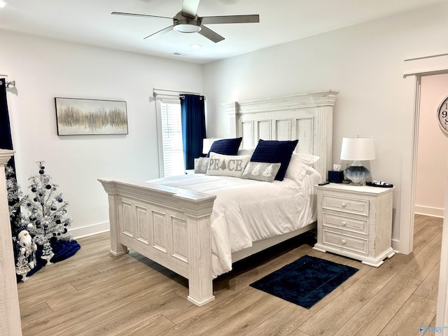 bedroom featuring ceiling fan and light hardwood / wood-style flooring