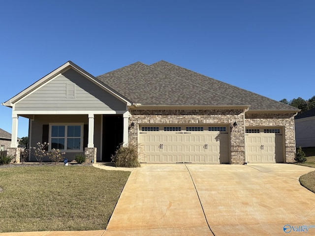 craftsman-style home with a garage and a front yard