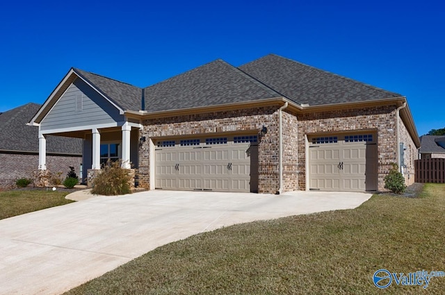 craftsman inspired home featuring a front lawn and a garage