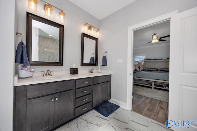 bathroom featuring hardwood / wood-style floors, vanity, ceiling fan, and ornamental molding