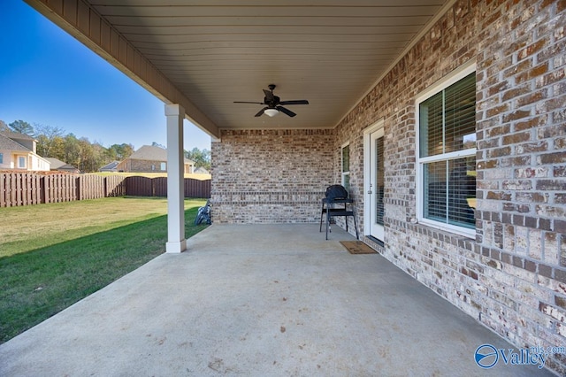 view of patio with ceiling fan and a grill