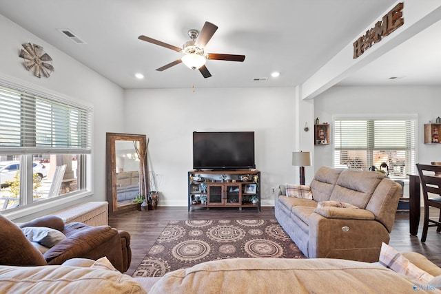 living room with wood-type flooring and ceiling fan