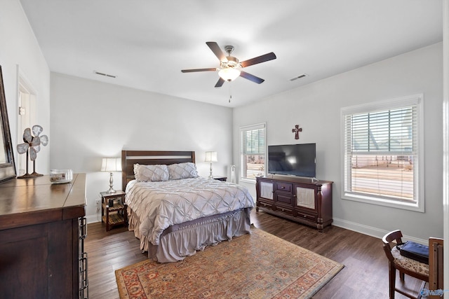 bedroom featuring dark hardwood / wood-style flooring and ceiling fan