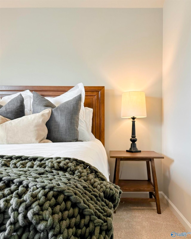 bedroom featuring light colored carpet