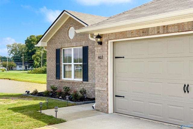 exterior space with a front lawn and a garage