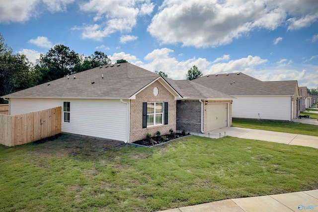 single story home featuring a front lawn and a garage