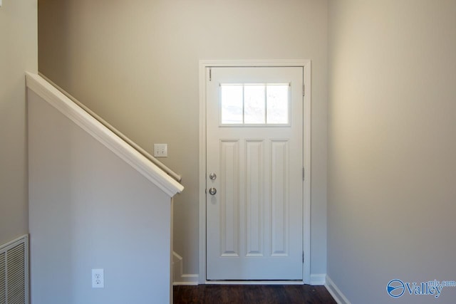 entryway with dark hardwood / wood-style flooring