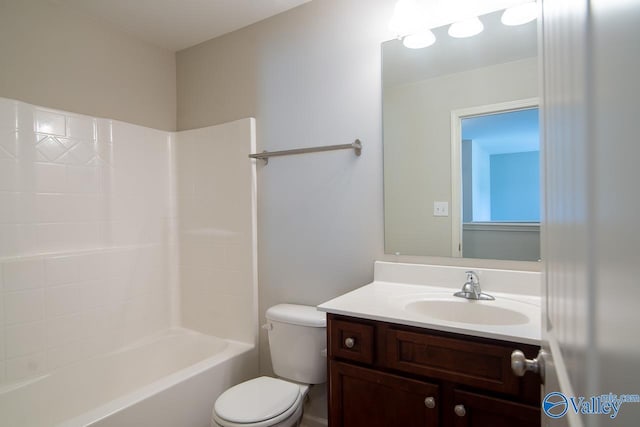 full bathroom featuring shower / bathing tub combination, vanity, and toilet