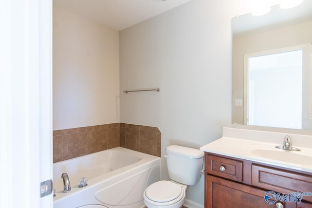 bathroom featuring vanity, toilet, and a bathing tub