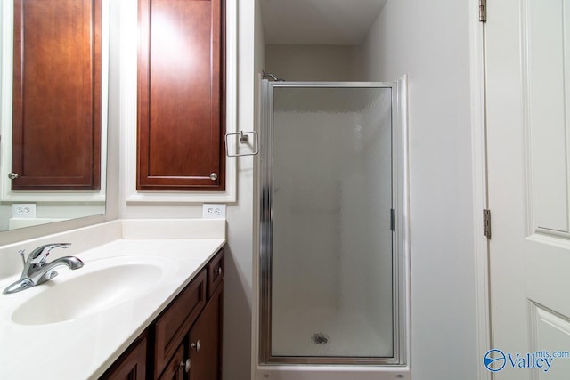 bathroom featuring vanity and walk in shower