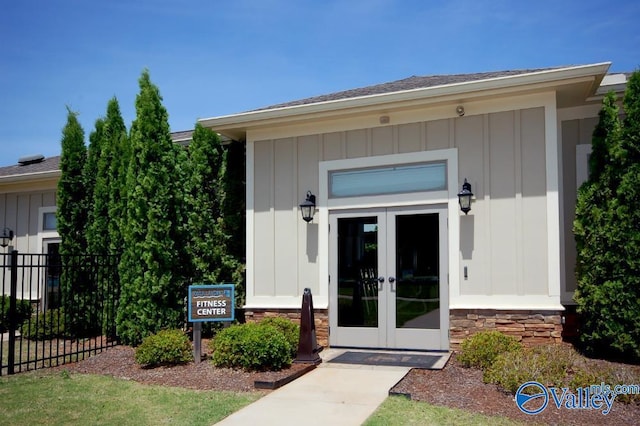 view of exterior entry featuring french doors