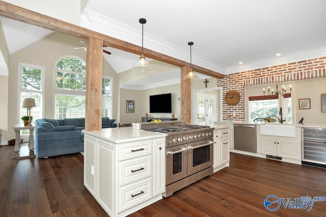 kitchen featuring beverage cooler, open floor plan, dark wood-style floors, a sink, and stainless steel appliances