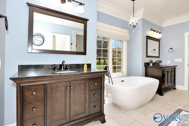 bathroom featuring crown molding, an inviting chandelier, a sink, two vanities, and a soaking tub