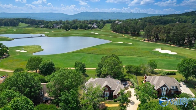 bird's eye view with a water and mountain view and golf course view