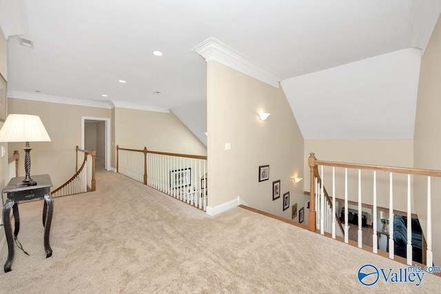 sitting room with carpet flooring, crown molding, an upstairs landing, and visible vents