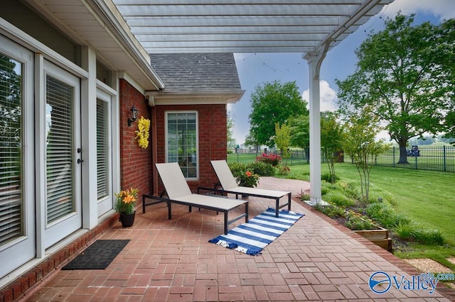 view of patio / terrace with a pergola and fence