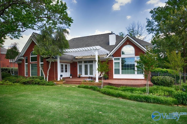 back of property featuring french doors, fence, a pergola, and a lawn