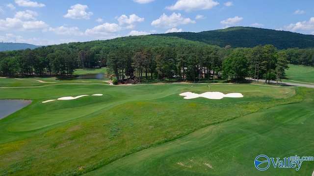 surrounding community featuring a mountain view and golf course view
