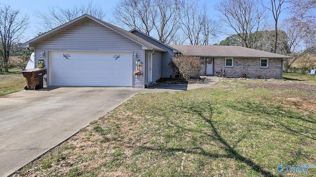 ranch-style home with an attached garage, concrete driveway, and a front lawn