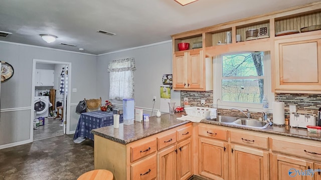 kitchen featuring visible vents, a sink, open shelves, washer / clothes dryer, and a peninsula