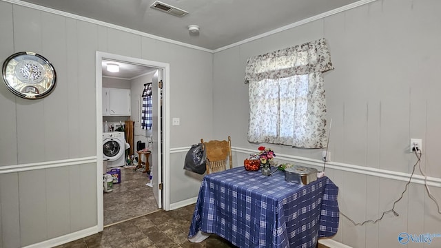 interior space with visible vents, washer / clothes dryer, and ornamental molding