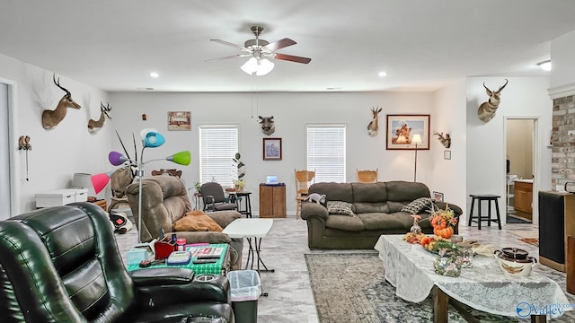 living room with recessed lighting and a ceiling fan