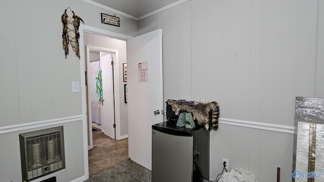 hallway with heating unit and crown molding