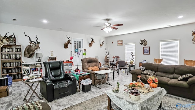 living area with visible vents, recessed lighting, and a ceiling fan