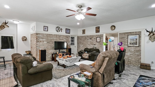 living area with recessed lighting, a ceiling fan, and brick wall