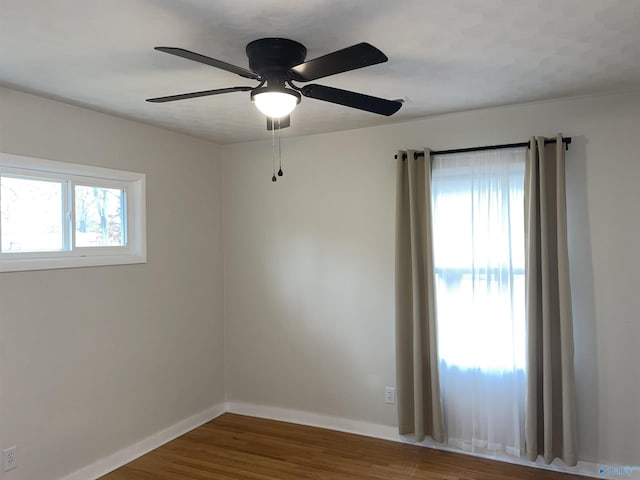 empty room with hardwood / wood-style floors