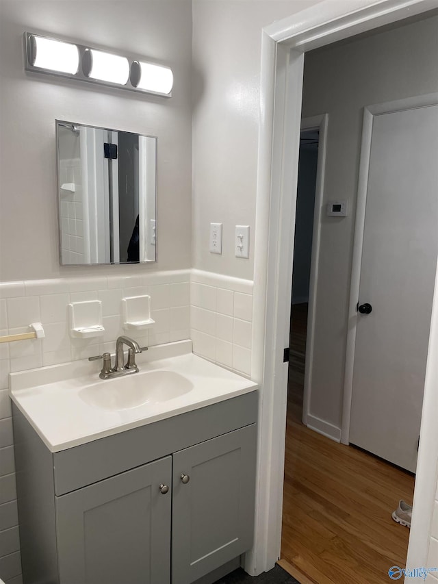 bathroom featuring wood-type flooring and vanity