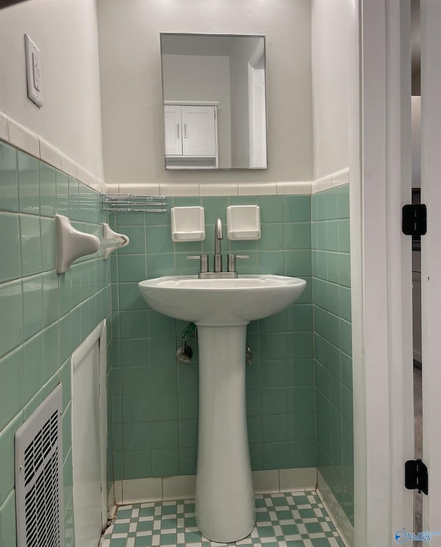 bathroom featuring tile walls and tile patterned flooring