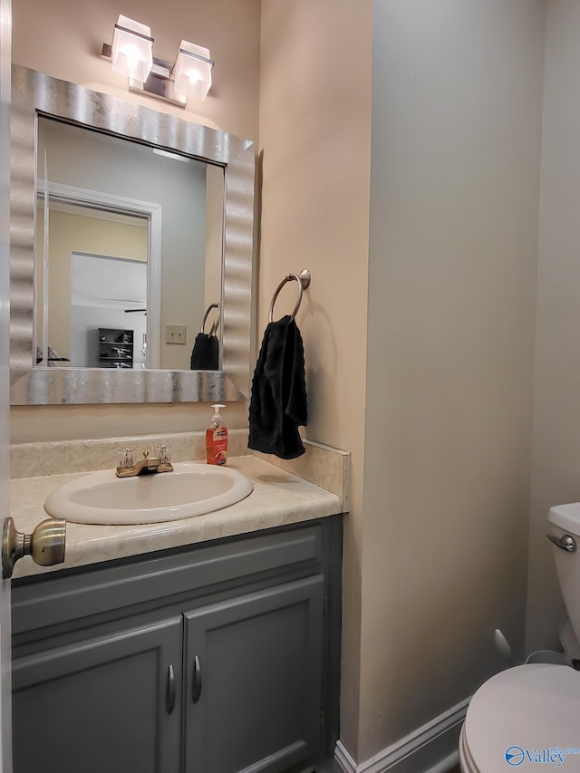 bathroom featuring vanity and toilet