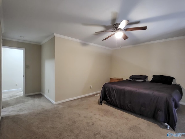 carpeted bedroom featuring ceiling fan and ornamental molding