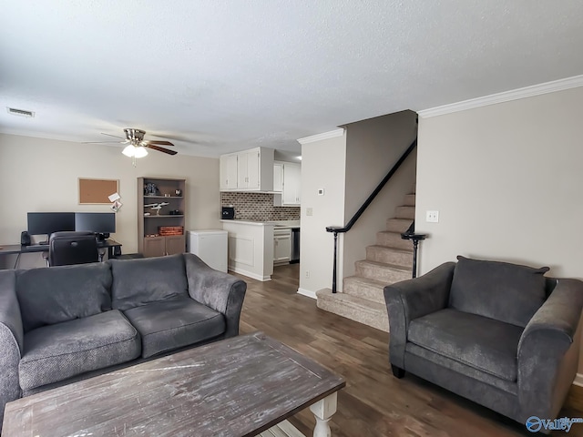 living room with ceiling fan, a textured ceiling, dark hardwood / wood-style floors, and crown molding