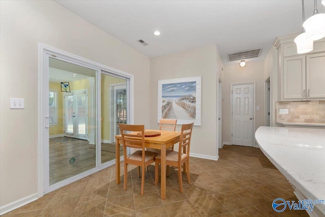 dining room with tile patterned flooring and french doors