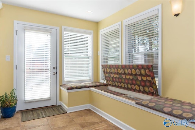 entryway with light tile patterned floors