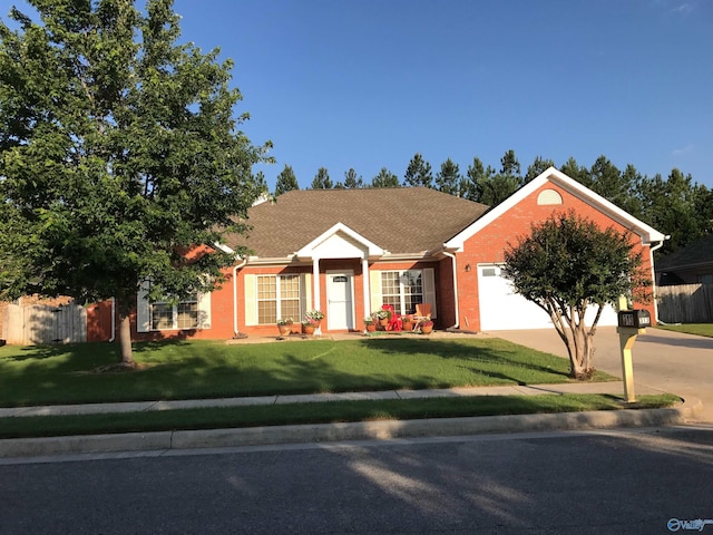 ranch-style house with a front yard and a garage