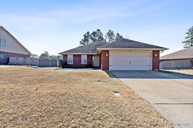 ranch-style home with a garage and a front lawn