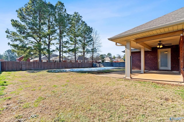 view of yard featuring ceiling fan and a patio area