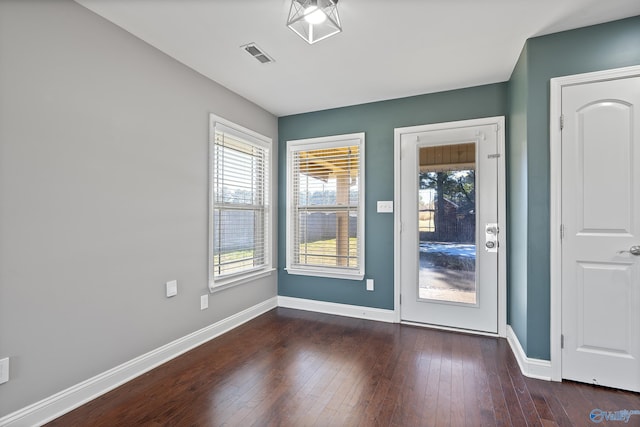 doorway featuring dark hardwood / wood-style floors