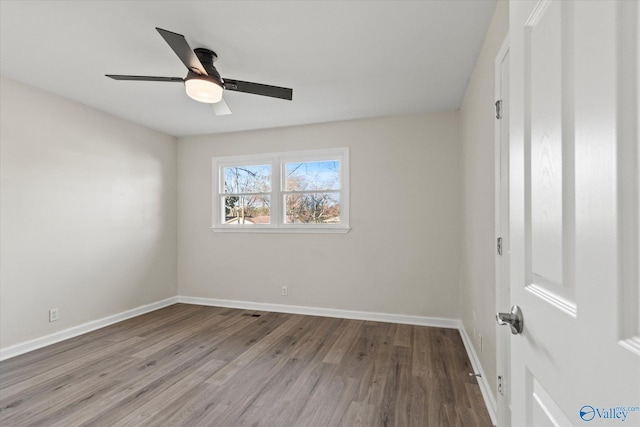 unfurnished bedroom featuring a ceiling fan, baseboards, and wood finished floors