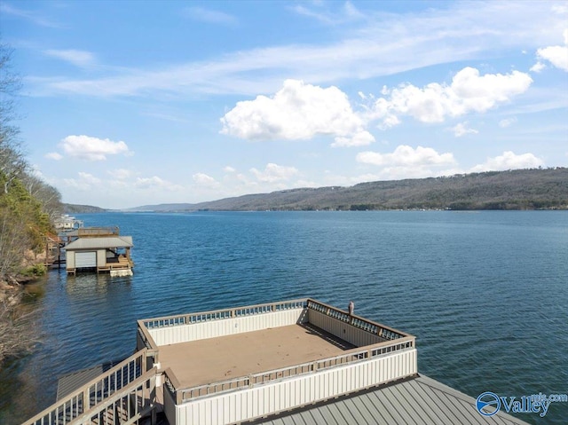 dock area featuring a water and mountain view