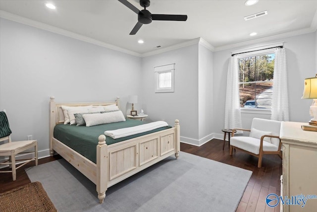 bedroom featuring ornamental molding, dark hardwood / wood-style floors, and ceiling fan