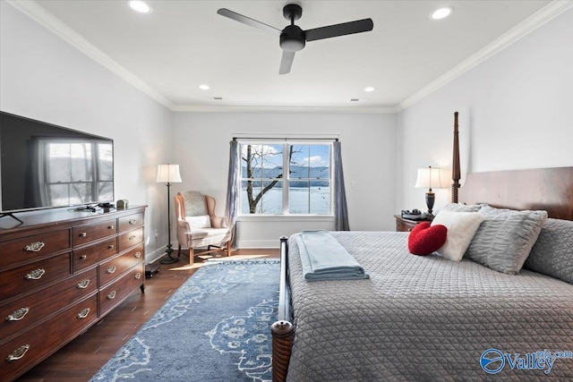 bedroom featuring crown molding, dark wood-type flooring, and ceiling fan